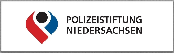 zu sehen ist ein rot, blaues Symbol in Herform mit einem schwarzen Kreis in der Mitte