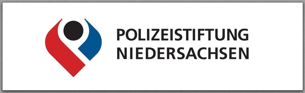 zu sehen ist ein rot, blaues Symbol in Herform mit einem schwarzen Kreis in der Mitte